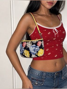 Coach Floral Print Wristlet Shoulder Bag in Navy and Yellow.